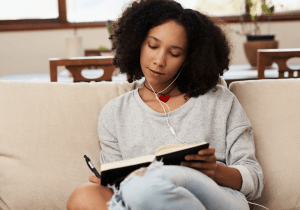 Woman letting go of what's holding her back onto paper